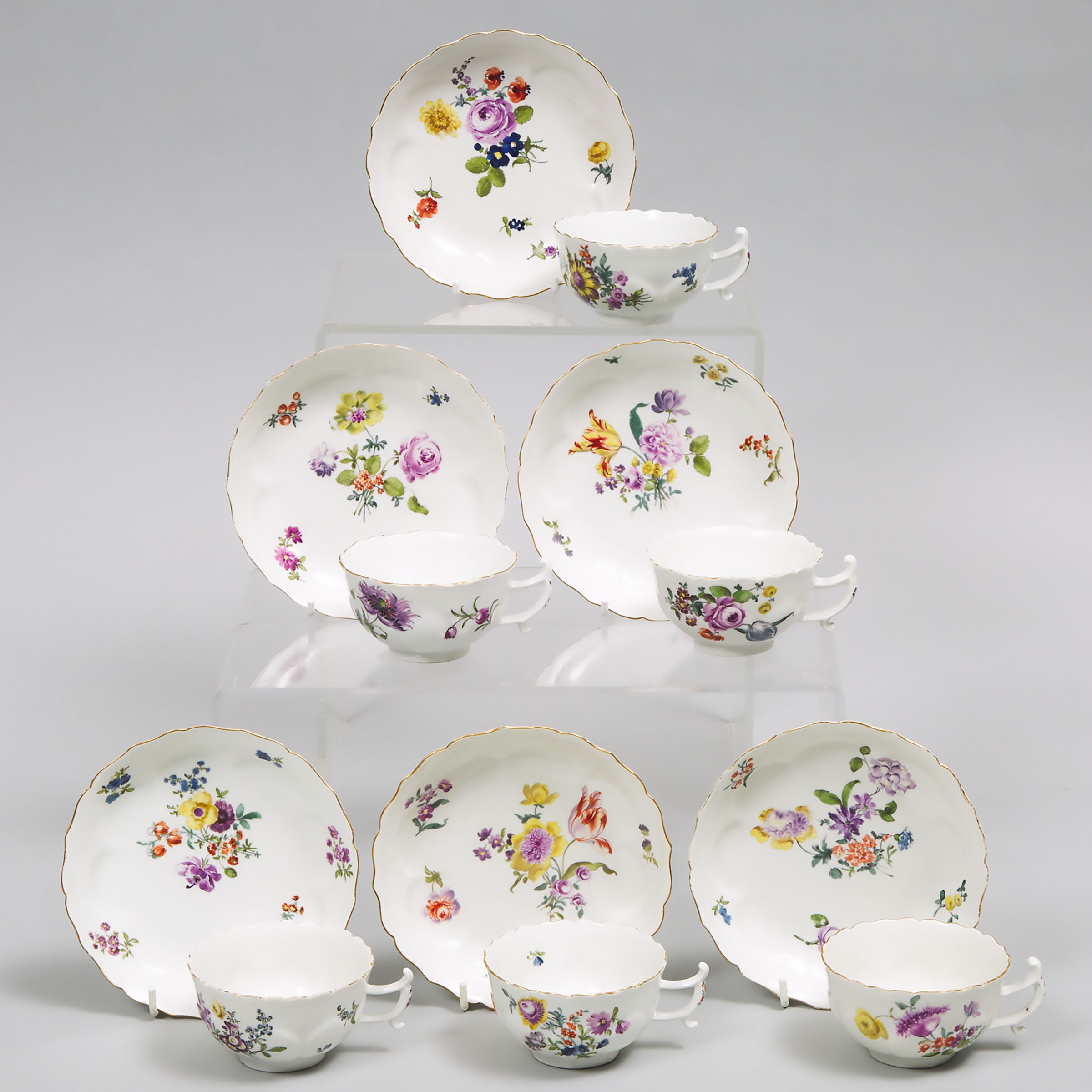 Six Meissen Flower Painted Petal Fluted Cups and Saucers, mid-18th century